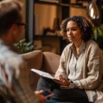 Therapist and client engaged in a supportive one-on-one therapy session, illustrating personalized attention