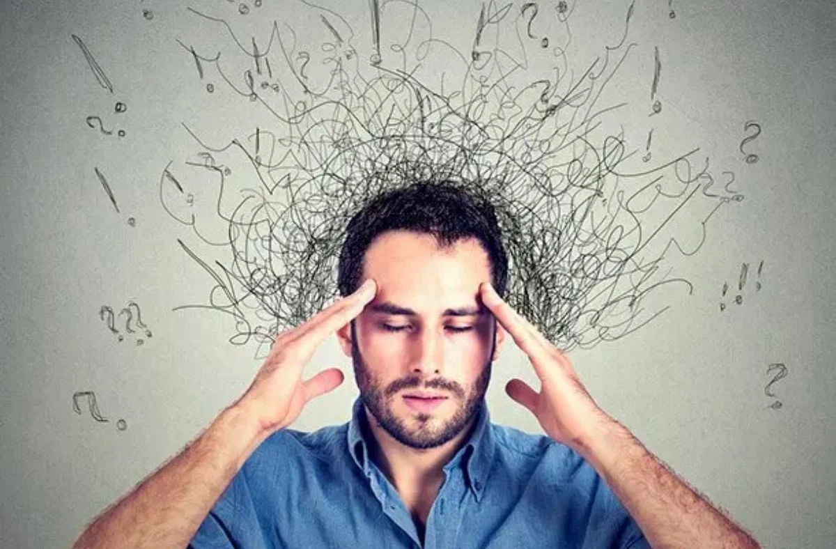 Client experiencing anxiety symptoms such as racing thoughts, tension, restlessness, and difficulty concentrating during counseling with Calm & Sense Therapy. 