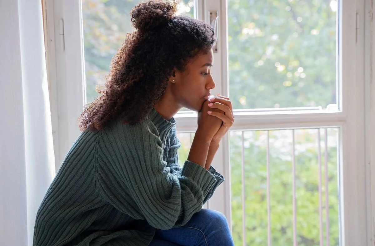 Client experiencing trauma-related symptoms such as hypervigilance, intrusive memories, emotional numbness, and anxiety during counseling with Calm & Sense Therapy.